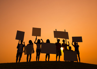 People Silhouette With Sign