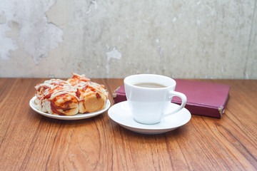 home made pizza coffee and book on table