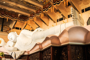 Reclining buddha in phu kon forest temple © takepicsforfun