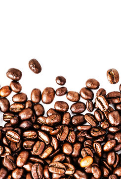 Closeup of roasted coffee beans  heap. Coffee Beans background t