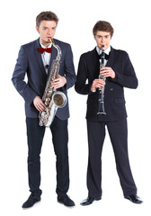 Naklejka premium Boys with saxophone and clarinet