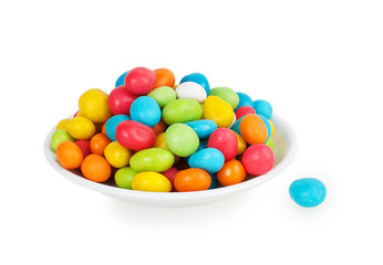 colored candies in white saucer
