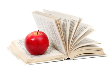 red apple on book isolated on white