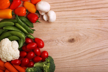 Healthy Organic Vegetables on a Wooden Background. Peppers