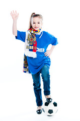 small and beautiful girl with a soccer ball