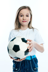 small and beautiful girl with a soccer ball