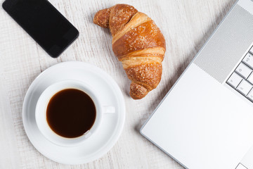 Notebook and mobile phone on Coffee Break