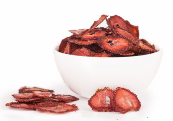 dry strawberry in a white plate it is isolated