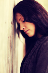 Happy woman in brown cardigan in winter day.