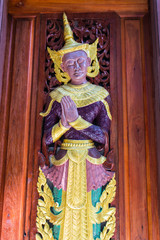 The angels are carved in the door of the temple , Shan style
