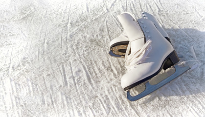 Women white skates. Abstract background on a winter sports theme