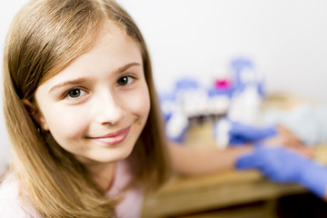 Allergy - skin prick tests, cute girl in a laboratory