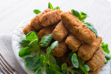 home-baked fish sticks with salad