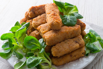 home-baked fish sticks with salad