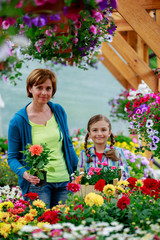 Garden center, family shopping plants and flowers