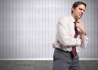 Composite image of thoughtful businessman holding pen to chin