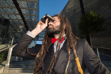Stylish elegant dreadlocks businessman binoculars