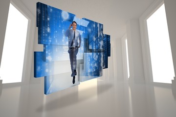 Composite image of businessman in data center on abstract screen