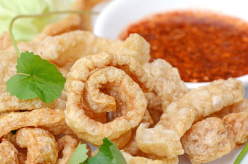  Pork snack, pork rind, pork scratching or pork crackling appetizers served with fresh vegetable...