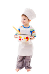 Little cook standing with ladle and pan