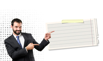 Businessman pointing to card over white background