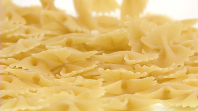 farfalle pasta falling and filling the screen in slow motion