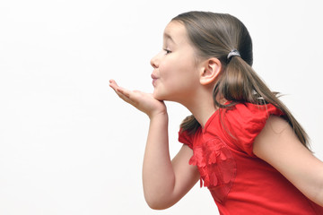 Little girl blowing kisses
