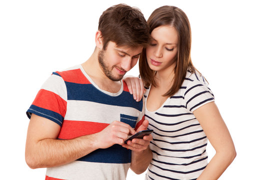 Couple busy with a smartphone