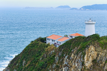 Fototapeta na wymiar White small lighthouse. Hong Kong