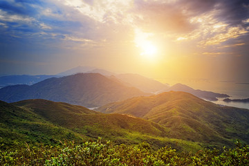 Beautiful summer landscape in the mountains with the sun at dawn