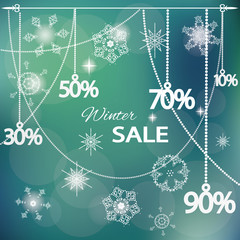Sale tags on winter blurred lights background.