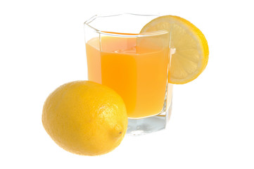 One lemon with glass with a slice of lemon filled with citrus ju