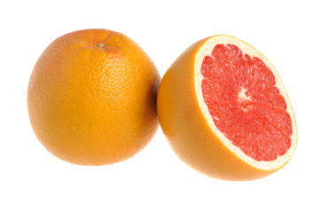 A half and a whole grapefruit on the white isolated