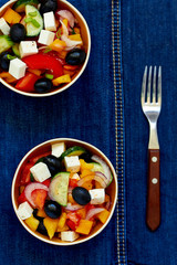 Greek salad with feta cheese, olives and vegetables