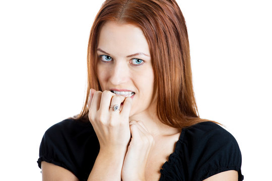 Nervous, anxious woman biting her fingernails