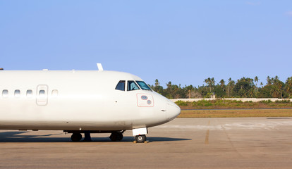 Fototapeta premium Airplane on airport runway