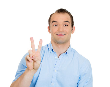 Succesfull man giving peace gesture sign, on white background 