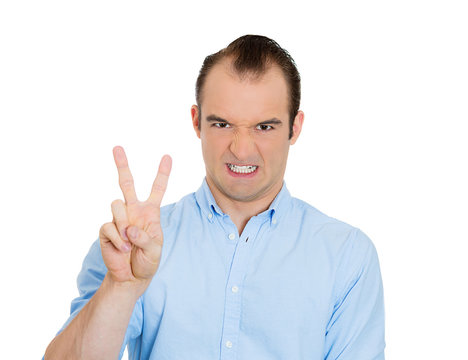 Sarcastic man giving victory, peace sign