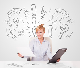 Attractive businesswoman brainstorming with drawn arrows and sym