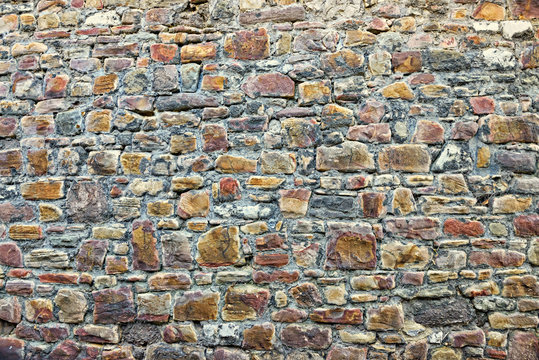 Gray stones of medieval wall in center of Huy