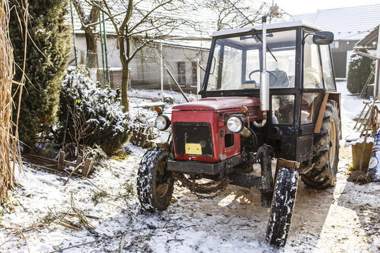 Old red Czech tractor in the winter