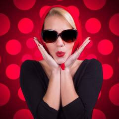 Pin-up girl over red polka-dot background