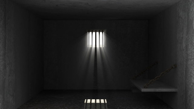 Old Grunge Prison Interior with sun rays and Closed Jail bars