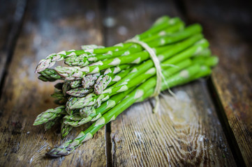 Asparagus on rustic wooden background