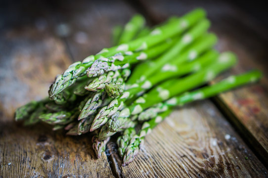 Asparagus on rustic wooden background