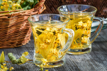 Tea made of lime and honey served in the garden
