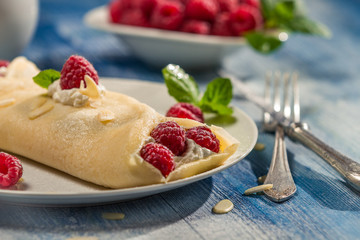 Pancakes with raspberry and whipped cream