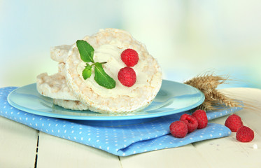 Tasty crispbread with berries, on white table