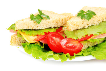 Fresh and tasty sandwiches on plate isolated on white