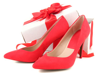Beautiful red female shoes and gift box, isolated on white